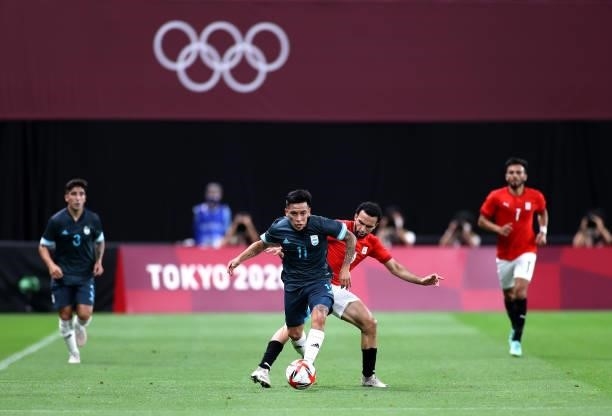 Esequiel Barco of Team Argentina is challenged by Karim Eraky of Team Egypt during the Men's First Round Group C match between Egypt and Argentina on...