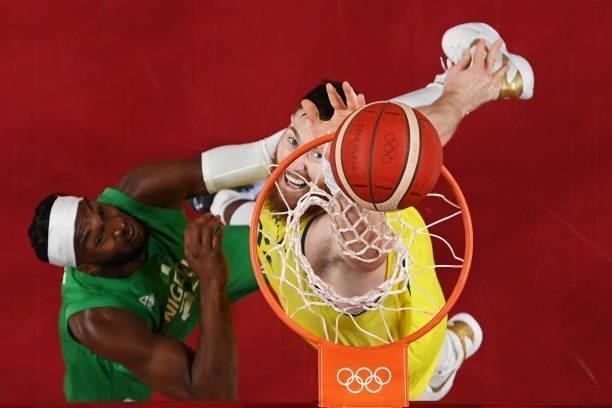 Aron Baynes of Team Australia and Josh Okogie of Team Nigeria battle for a rebound in the first half of their Men's Preliminary Round Group B game on...