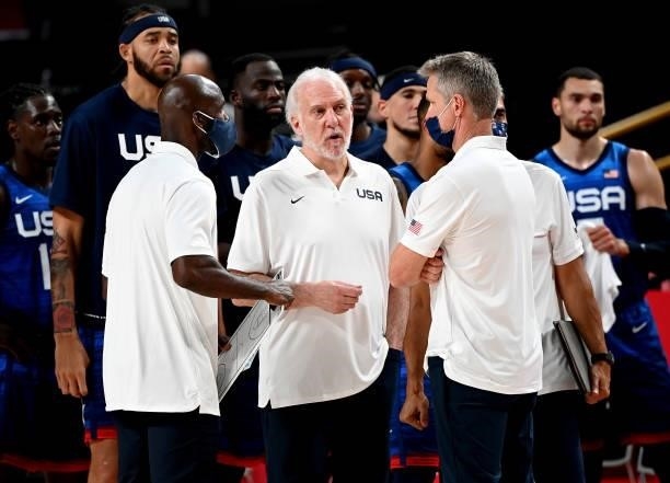 Coach Gregg Popovich of the USA chats to his coaching assistants Steve Kerr and Lloyd Pierce during the preliminary rounds of the Men's Basketball...
