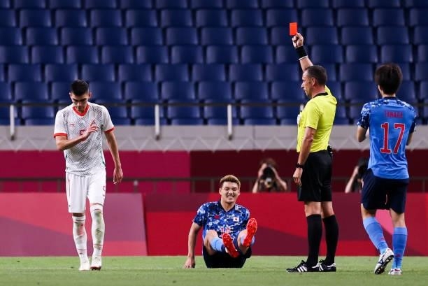 Referee Dias Artur gives a red card to Vega Alexis of Mexico during the Men's First Round Group A match between Japan and Mexico on day two of the...