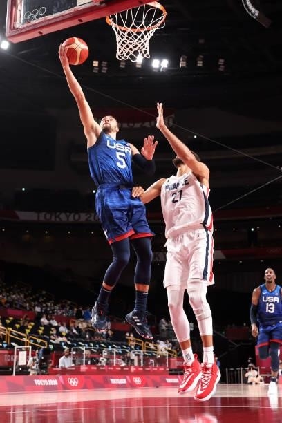 Zachary Lavine of Team United States drives to the basket for a layup over Rudy Gobert of Team France during the first half of the Men's Preliminary...