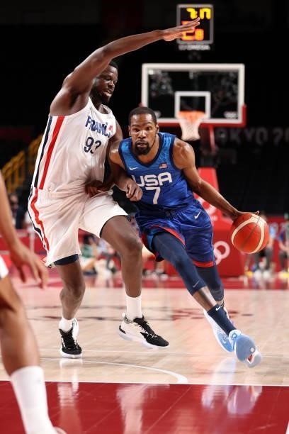 Kevin Durant of Team United States drives past Moustapha Fall of Team France during the first half of the Men's Preliminary Round Group B game on day...