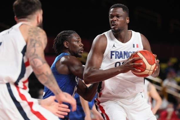 Moustapha Fall of Team France attempts to drive past Jrue Holiday of Team United States during the second half of the Men's Preliminary Round Group B...