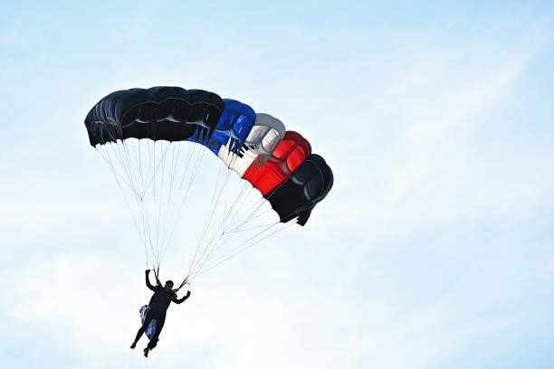 Parachutist lands on the eighteenth green during day four of the The Amundi Evian Championship at Evian Resort Golf Club on July 25, 2021 in...