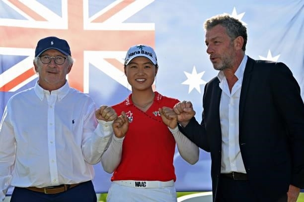 Tournament winner Minjee Lee of Australia celebrates with Jacques Bungert, Director of the Amundi Evian Championship and Franck Riboud during day...