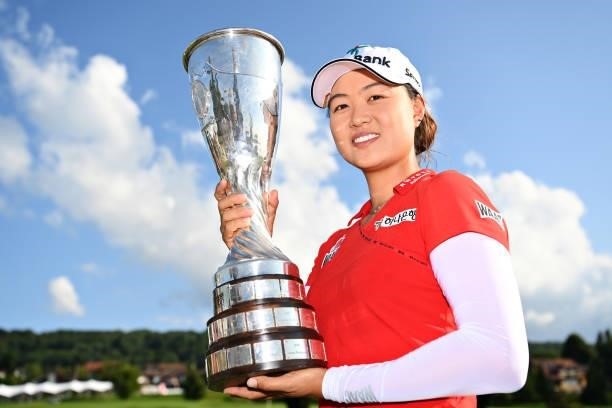 Tournament winner Minjee Lee of Australia poses for a photo with her trophy during day four of the The Amundi Evian Championship at Evian Resort Golf...