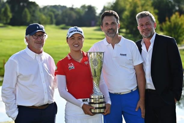 Tournament winner Minjee Lee of Australia celebrates with Jacques Bungert, Director of the Amundi Evian Championship and Franck Riboud during day...