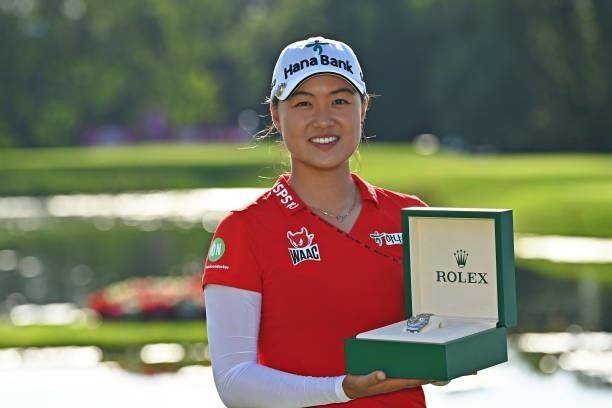 Tournament winner Minjee Lee of Australia poses for a photo with a prize from Rolex during day four of the The Amundi Evian Championship at Evian...