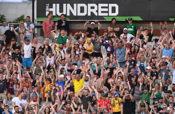 The 100 crowd partake in a mexican wave during the Hundred match between Manchester Originals and Birmingham Phoenix at Emirates Old Trafford on July...