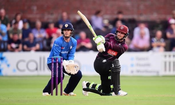 Steve Davies of Somerset plays a shot as Brooke Guest of Derbyshire looks on during the Royal London One Day Cup match between Somerset and...