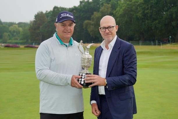 Stephen Dodd of Wales poses with Ryan Howsam, CEO Staysure after the final round of the Senior Open presented by Rolex at Sunningdale Golf Club on...