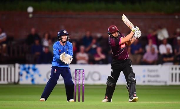 James Hildreth of Somerset plays a shot as Brooke Guest of Derbyshire looks on during the Royal London One Day Cup match between Somerset and...