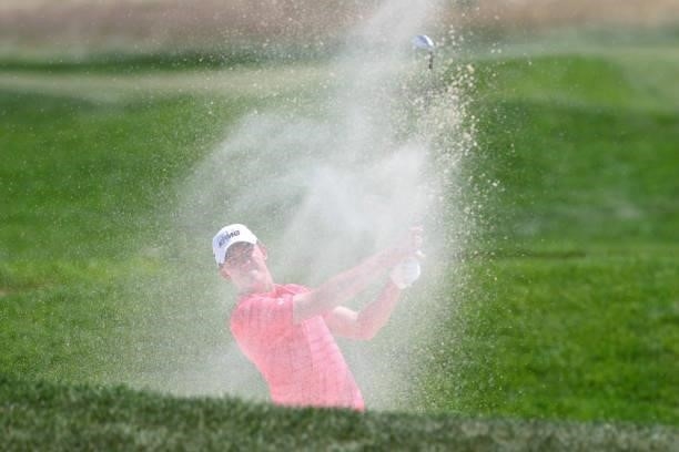 Maverick McNealy plays his shot from the bunker on the first hole during the final round of the 3M Open at TPC Twin Cities on July 25, 2021 in...