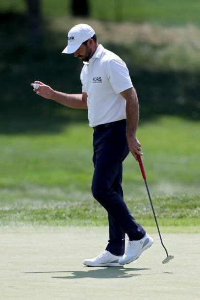 Charl Schwartzel of South Africa reacts after making par on the first green during the final round of the 3M Open at TPC Twin Cities on July 25, 2021...