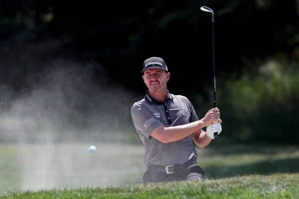 Jimmy Walker plays his shot from the bunker on the first hole during the final round of the 3M Open at TPC Twin Cities on July 25, 2021 in Blaine,...