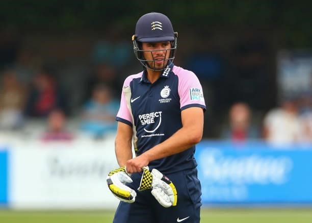 Max Holden of Middlesex putting on his gloves during the Royal London Cup match between Essex and Middlesex at Cloudfm County Ground on July 25, 2021...