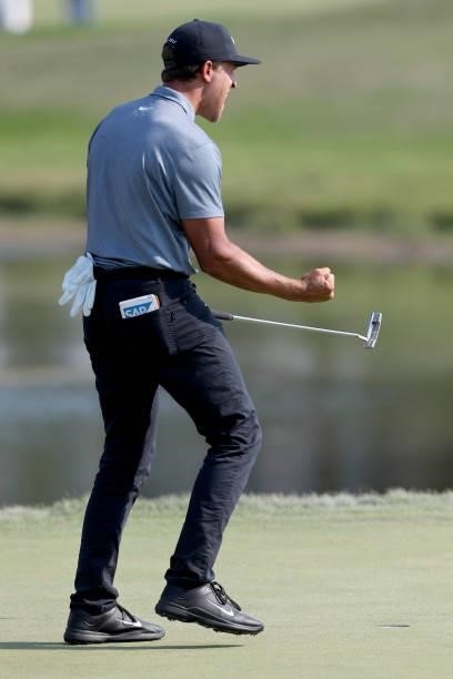 Cameron Champ reacts after making par on the 18th green to finish his round during the final round of the 3M Open at TPC Twin Cities on July 25, 2021...