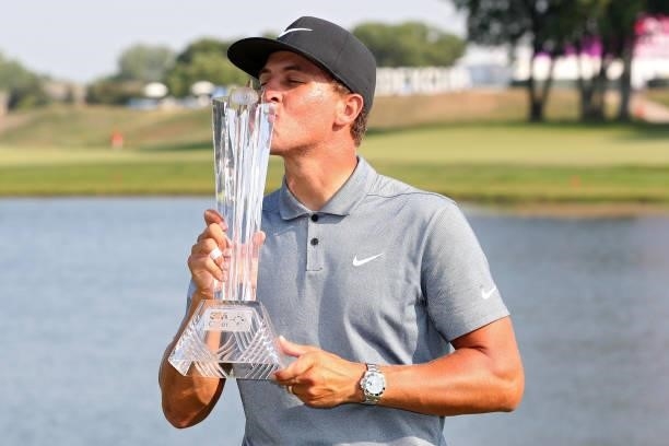 Cameron Champ kisses the trophy after winning the 3M Open at TPC Twin Cities on July 25, 2021 in Blaine, Minnesota.