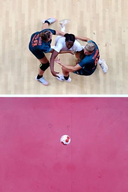 Grace Zaadi Deuna of Team France shoots at goal whilst being challenged by Zsuzsanna Tomori and Reka Bordas of Team Hungary during the Women's...