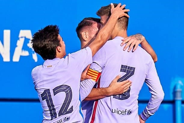 Players of FC Barcelona celebrating their team's first goal during a friendly match between FC Barcelona and Girona FC at Estadi Johan Cruyff on July...