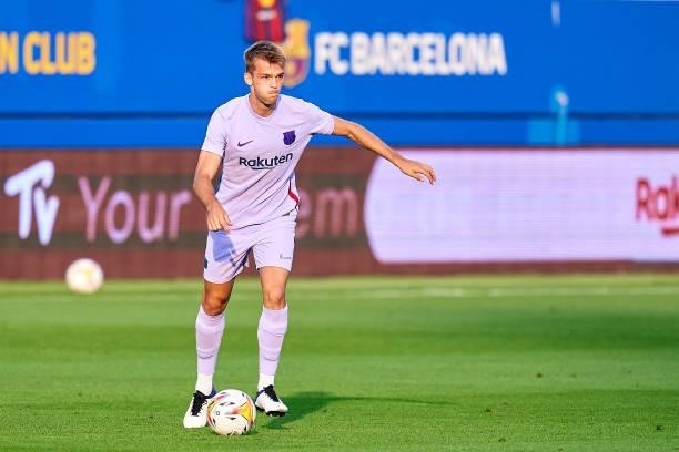 Arnau Comas of FC Barcelona with the ball during a friendly match between FC Barcelona and Girona FC at Estadi Johan Cruyff on July 24, 2021 in...