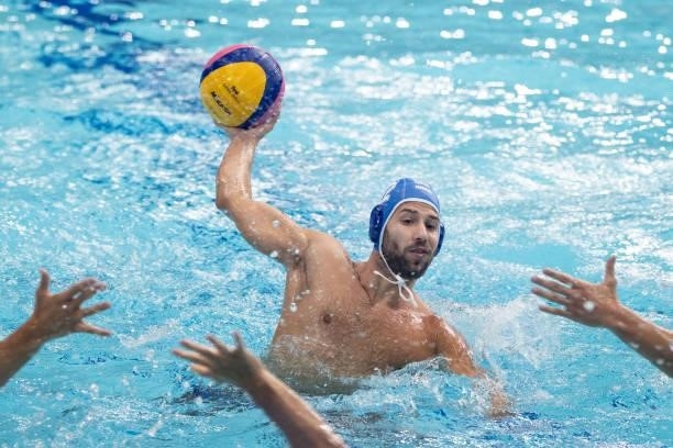 Angelos Vlachopoulos of Team Greece looks to evade the Hungary defense during the Men's Preliminary Round Group A match between Hungary and Greece on...