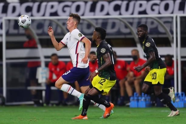 Devon Williams of Jamaica and Sam Vines of United States fight for the ball during to the a quarterfinal match between United States and Jamaica as...