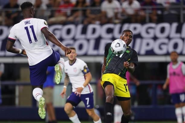 Damion Lowe of Jamaica and Daryl Dike of United States fight the ball during the quarterfinal match between United States and Jamaica as part of 2021...