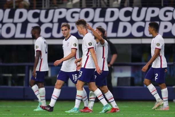 Matthew Hoppe of United States celebrates with his teammates after scoring his team's first goal during the quarterfinal match between United States...