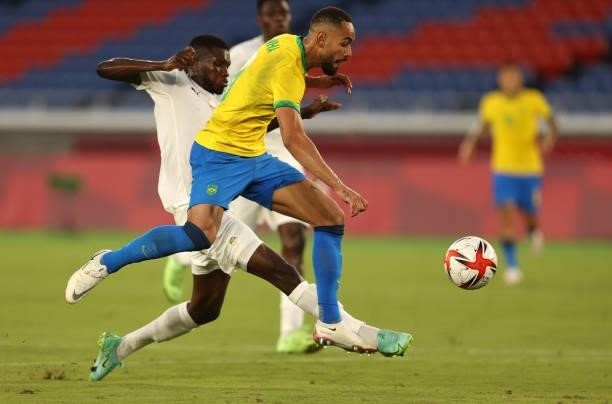 Matheus Cunha of Team Brazil battles for possession with Ismael Diallo of Team Ivory Coast during the Men's First Round Group D match on day two of...