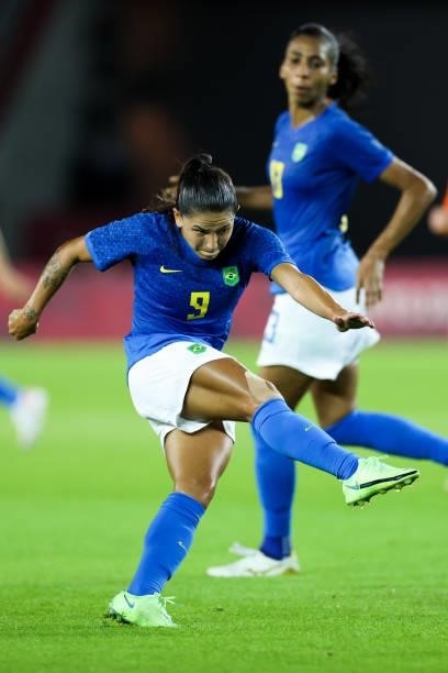 Debinha of Brazil shots the ball during the Women's First Round Group F match on day one of the Tokyo 2020 Olympic Games at Miyagi Stadium on July...