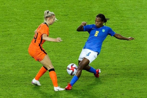 Formiga of Brazil competes for the ball with Groenen Jackie of Netherland during the Women's First Round Group F match on day one of the Tokyo 2020...