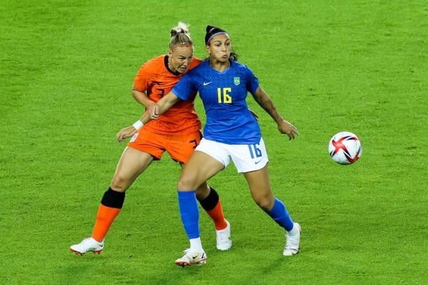 Beatriz of Brazil competes for the ball with Van Der Gragt Stefanie of Netherland during the Women's First Round Group F match on day one of the...