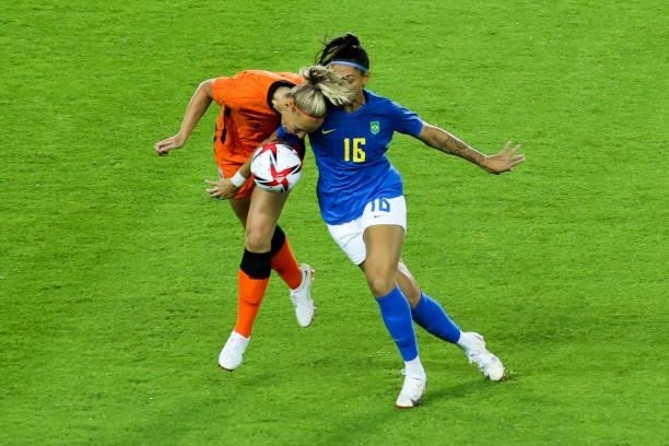 Beatriz of Brazil competes for the ball with Van Der Gragt Stefanie of Netherland during the Women's First Round Group F match on day one of the...