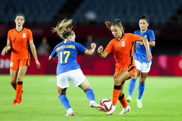 Martens Lieke of Netherlands competes for the ball with Andressinha of Brazil during the Women's First Round Group F match on day one of the Tokyo...