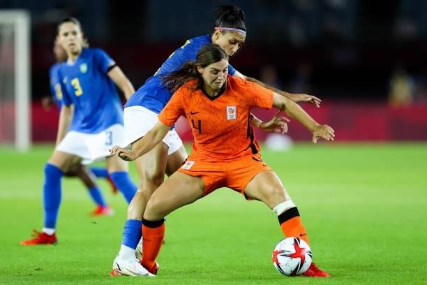 Nouwen Aniek of Netherlands competes for the ball with Beatriz of Brazil during the Women's First Round Group F match on day one of the Tokyo 2020...