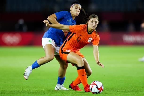 Nouwen Aniek of Netherlands competes for the ball with Beatriz of Brazil during the Women's First Round Group F match on day one of the Tokyo 2020...