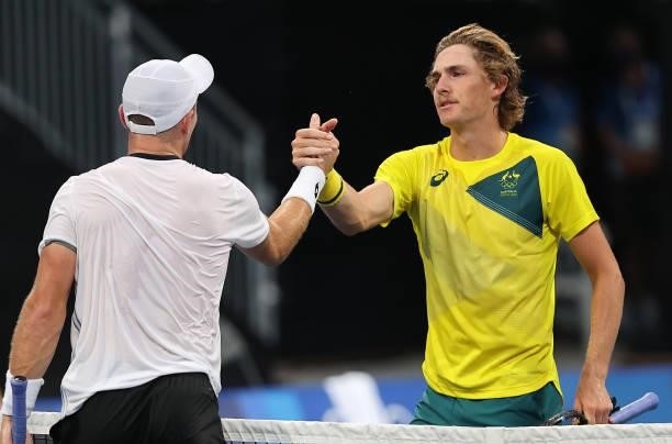 Dominik Koepfer of Team Germany and Max Purcell of Team Australia shake hands after their Men's Singles Second Round match on day three of the Tokyo...