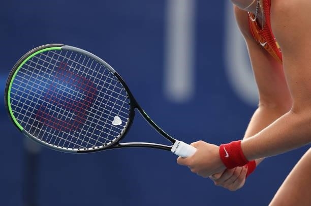 Heart-shaped dampener fixed to Paula Badosa of Team Spain's racket during her Women's Singles Second Round match against Iga Swiatek of Team Poland...