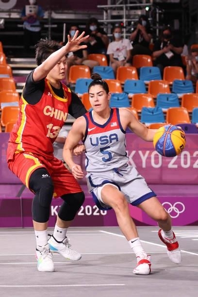 Kelsey Plum of Team United States handles the ball under pressure from Jiyuan Wan of Team China in the 3x3 Basketball competition on day three of the...