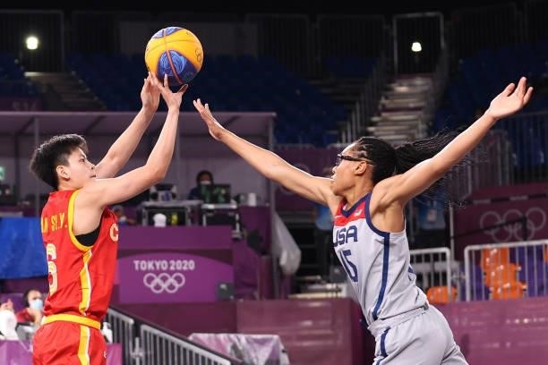 Shuyu Yang of Team China shoots against Allisha Gray of Team United States in the 3x3 Basketball competition on day three of the Tokyo 2020 Olympic...
