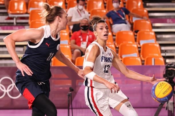 Laetitia Guapo of Team France handles the ball against Anastasiia Logunova of Team ROC in the 3x3 Basketball competition on day three of the Tokyo...