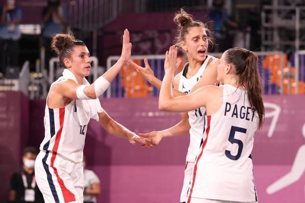 Laetitia Guapo, Ana Maria Filip and Marie-Eve Paget of Team France celebrate victory in the 3x3 Basketball competition on day three of the Tokyo 2020...