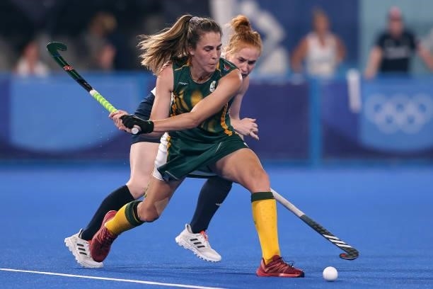 Lisa-Marie Deetlefs of Team South Africa and Sarah Louise Jones of Team Great Britain battle for the ball during the Women's Preliminary Pool A match...
