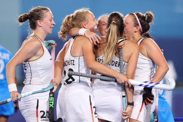 Anne Katarina Schroder of Team Germany celebrates with teammates after scoring their team's second goal during the Women's Preliminary Pool A match...