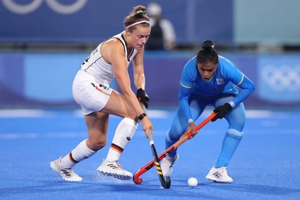 Charlotte Stapenhorst of Team Germany holds off Deep Grace Ekka of Team India during the Women's Preliminary Pool A match between Germany and India...