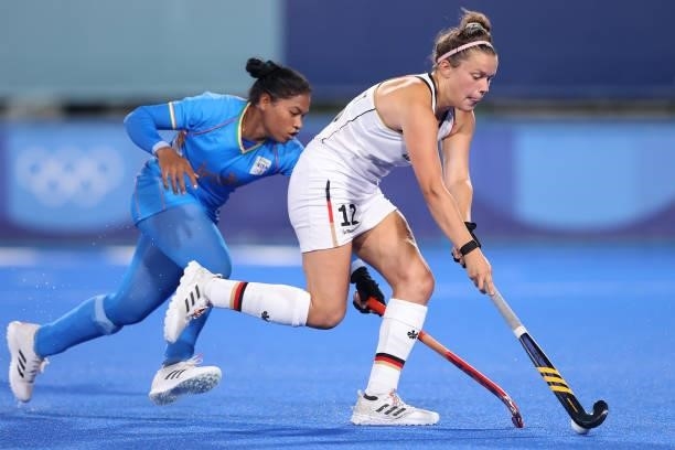 Charlotte Stapenhorst of Team Germany holds off Deep Grace Ekka of Team India during the Women's Preliminary Pool A match between Germany and India...