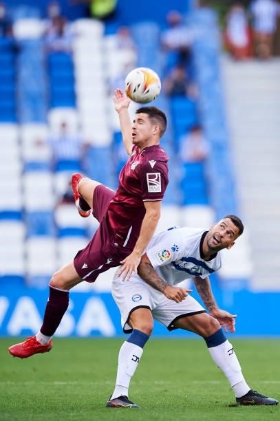 Igor Zubeldia of Real Sociedad duels for the ball with Edgar Mendez of Deportivo Alaves during the Friendly Match between Real Sociedad and Deportivo...