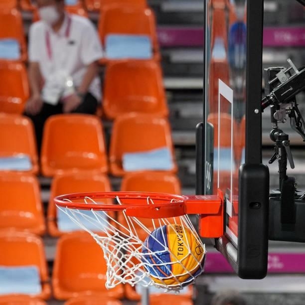 The basketball falls through the basket during the Men's Pool Round match between Netherlands and Belgium in the 3x3 Basketball competition on day...