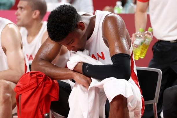 Rui Hachimura of Team Japan reacts in disappointment as he sits on the bench during the second half of the Men's Preliminary Round Group C game...